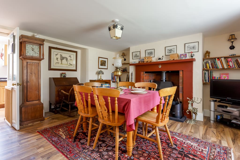 Large dining room with working log burner.