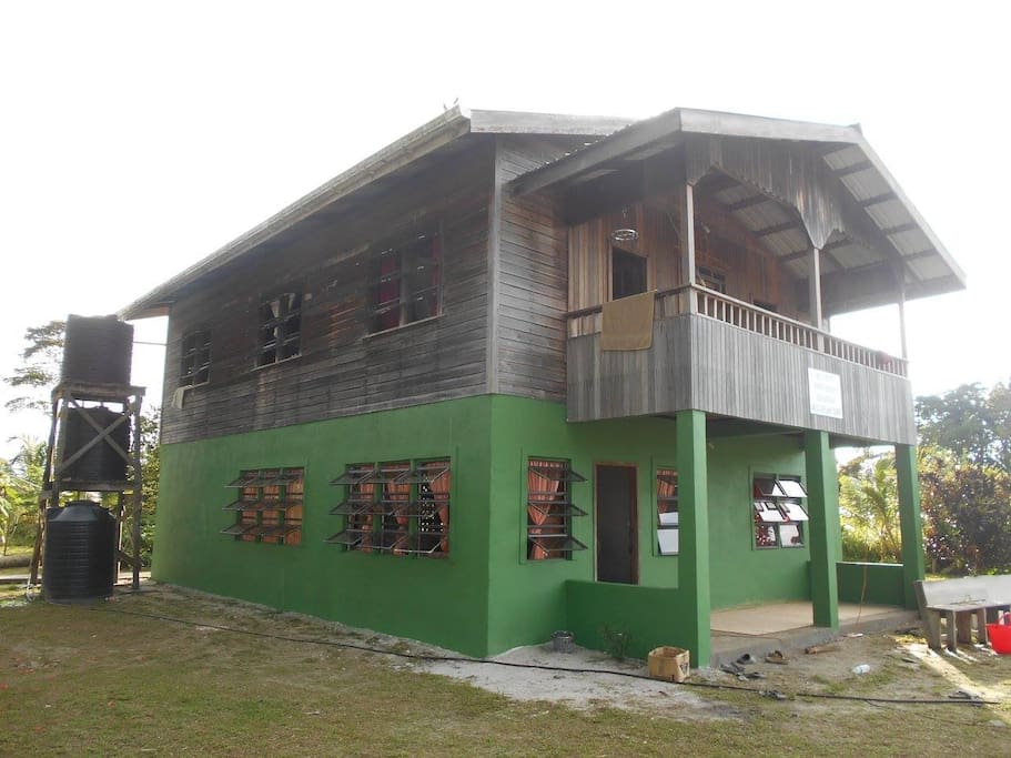 The Homestay Eco Lodge building surrounded by low jungle, rivers and savannas.