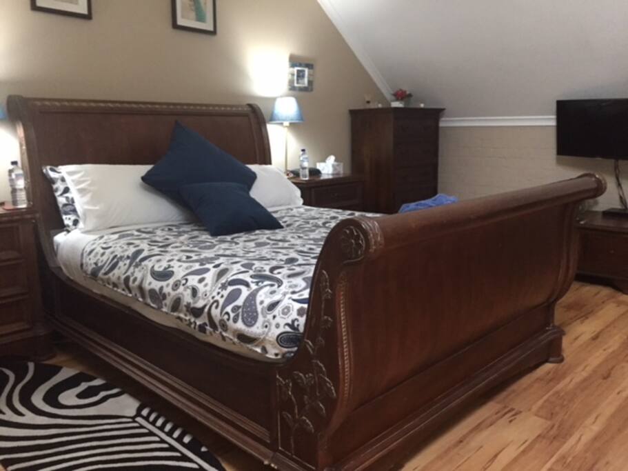 Queen sleigh bed with pillow top mattress and quality linens