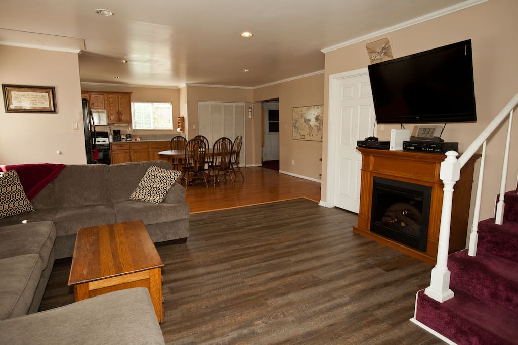 Open floor plan with living room, dining room, kitchen and laundry room.
