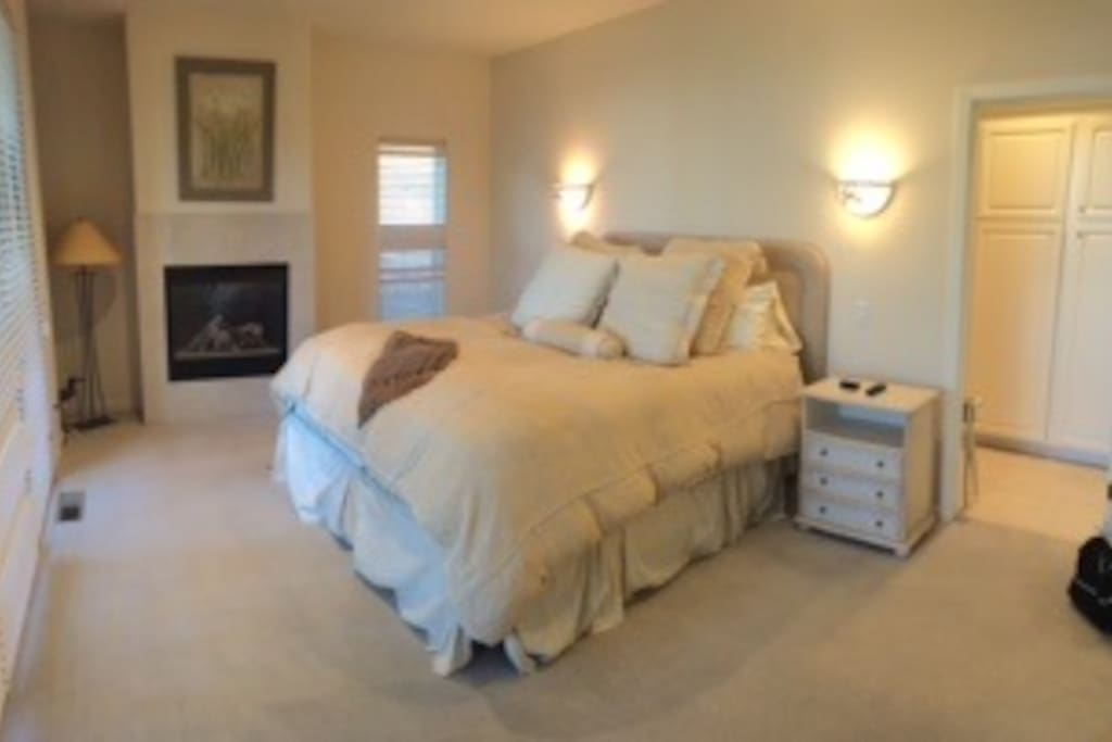 Master bedroom, with fireplace and own bathroom! Super comfy King bed.