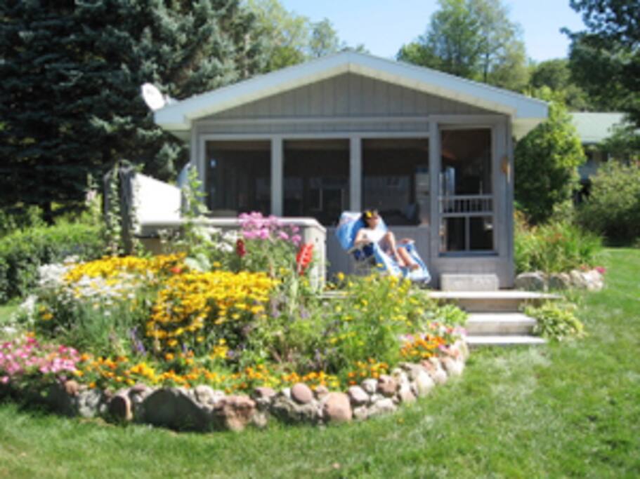 The view of the Hot Tub and summer screened room which over looks the lake.