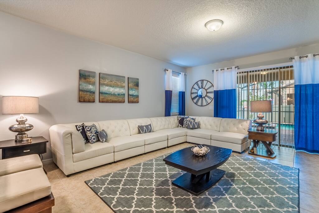 Living room with leather sectional sofa with flat screen TV