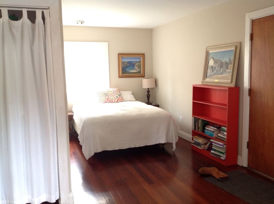 Sealy Posturepedic queen bed on the other side of bedroom