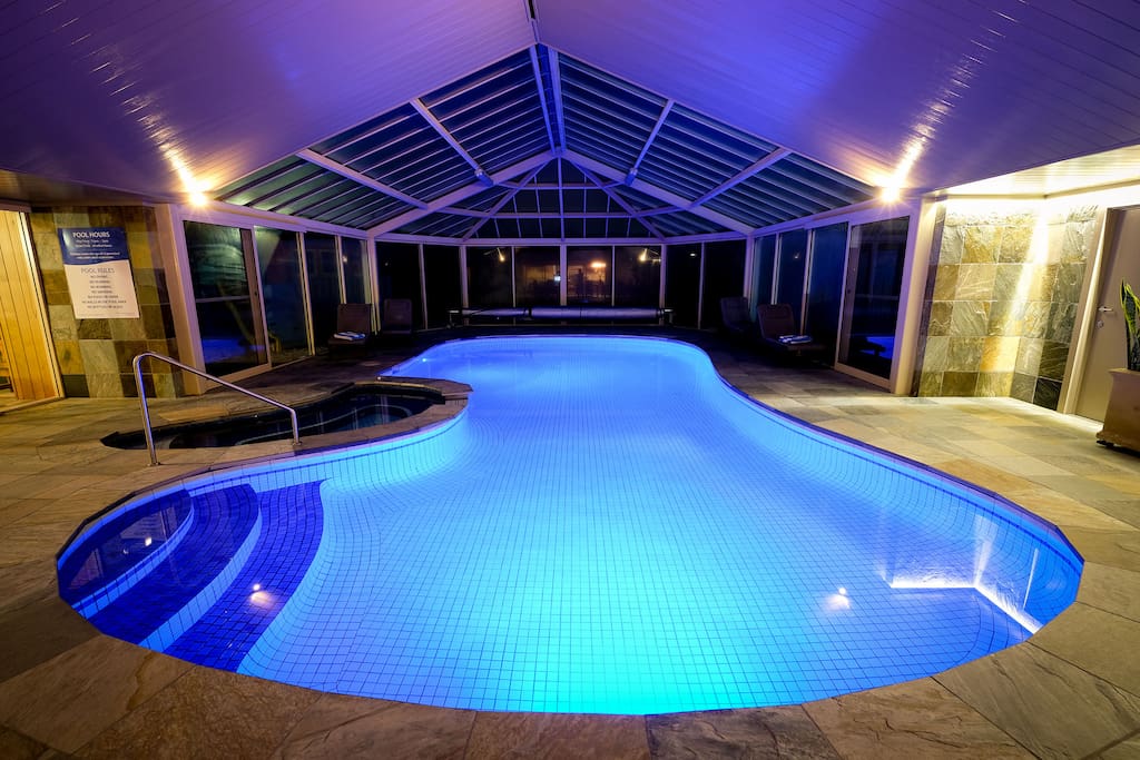 Indoor heated pool/spa at night