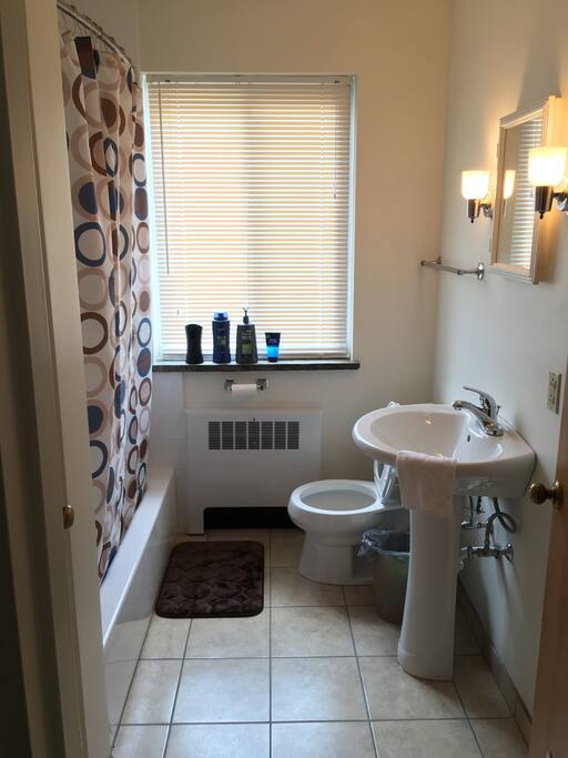 The bathroom is very clean with new fittings and has a spacious bathtub with a nice shower.