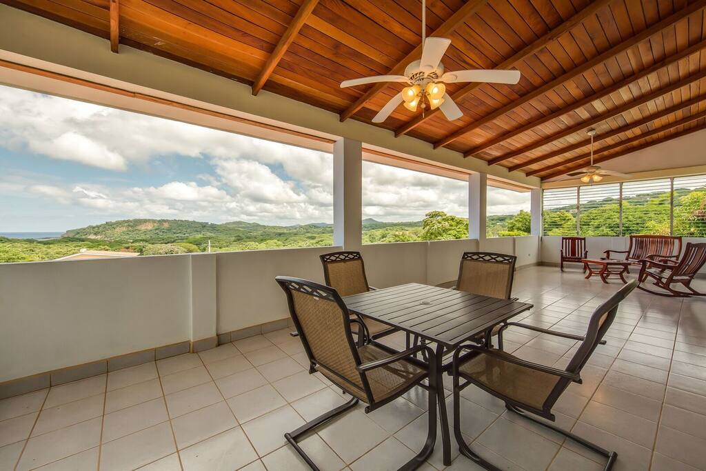 Relax, eat and read on the expansive balcony.