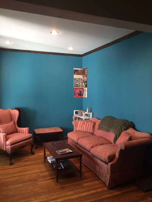 The living room. Bay windows (lots of light), a couch, chair, bench, coffee table, an additional desk (not pictured)...all waiting for you!