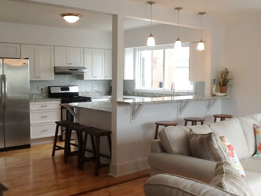 Open Plan Kitchen. Washer/Dryer off kitchen. Stainless, microwave, gas stove, oven, garbage disposal.