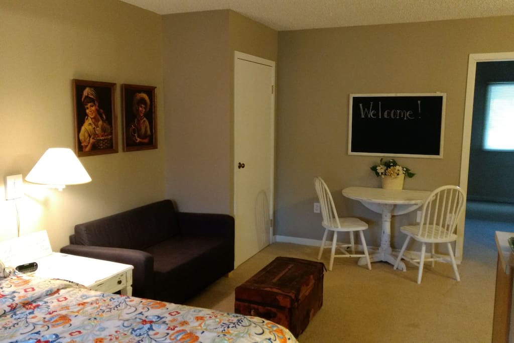 Room 1- King bed with small pullout love-seat, kitchenette and dining area
