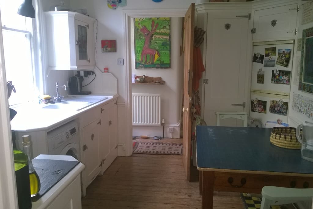 This is my kitchen with a table for four. There is a door out to the garden in the corridor