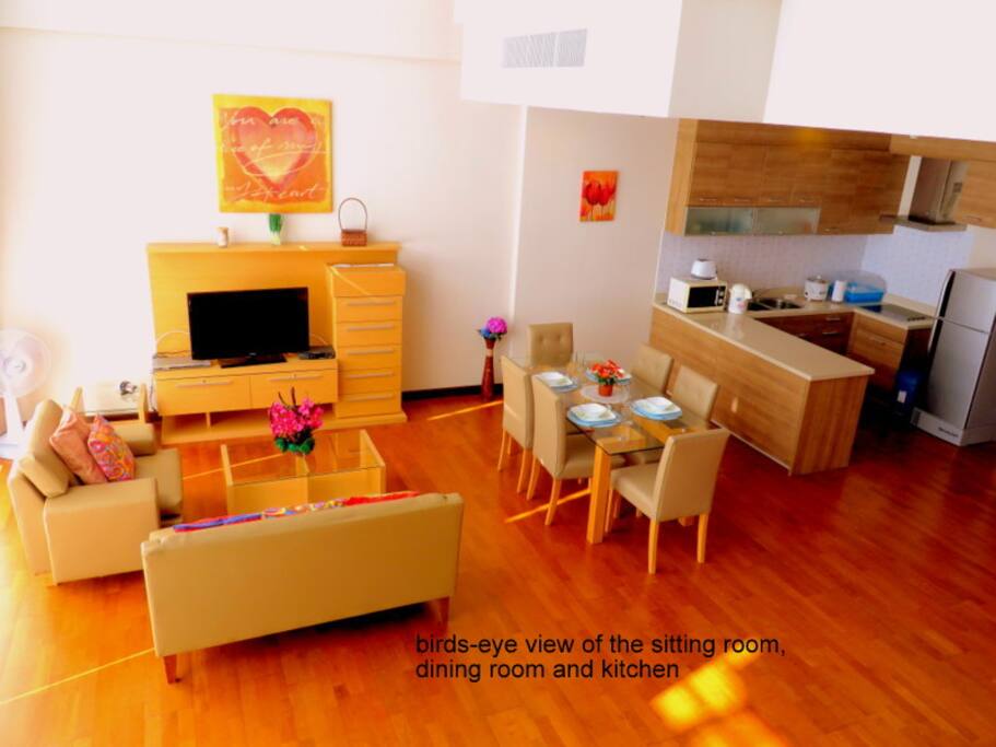 The dining area, adjacent to the kitchen. You also see part of the sitting room.