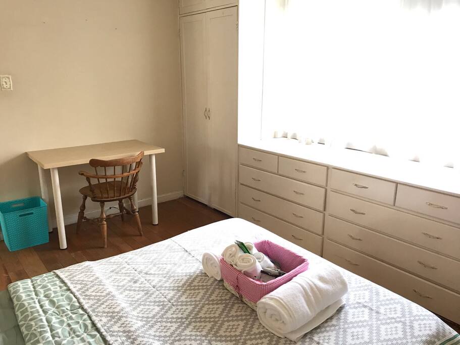 Traveling for business or as a student? A large desk and comfortable wooden chair with plenty of natural sunlight will help you get the job done!