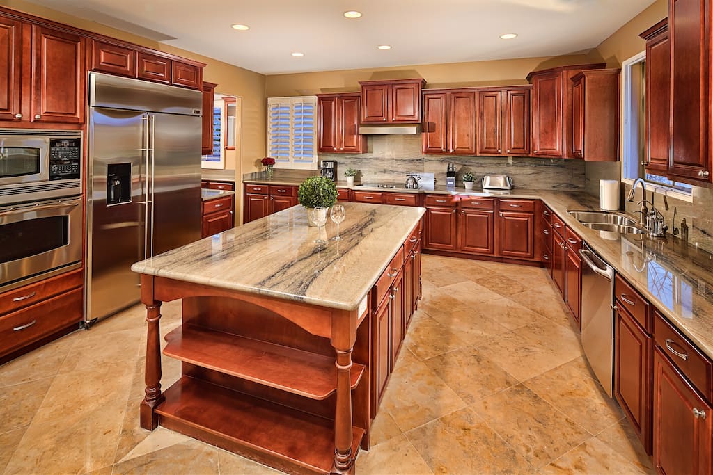 Stunning kitchen with solid wood cabinets and granite counters.