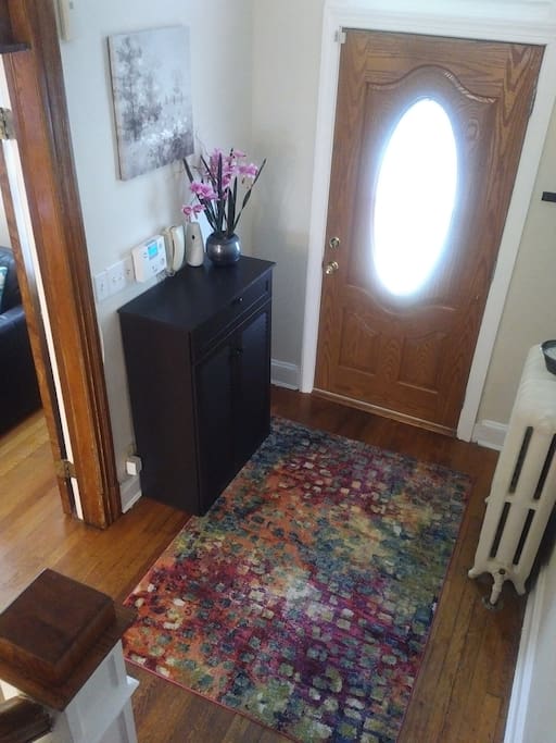 Foyer at entrance door has shoe cabinet to store shoes and other accessories.