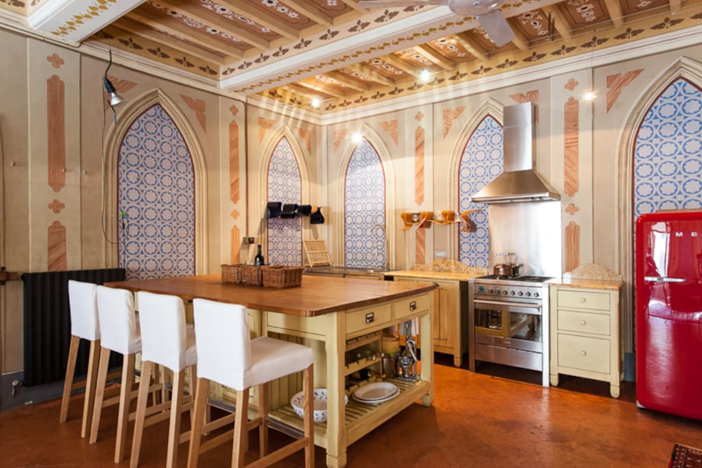 The kitchen end of the "salone". The island was made by a local carpenter. Everyone comments on our red fridge!