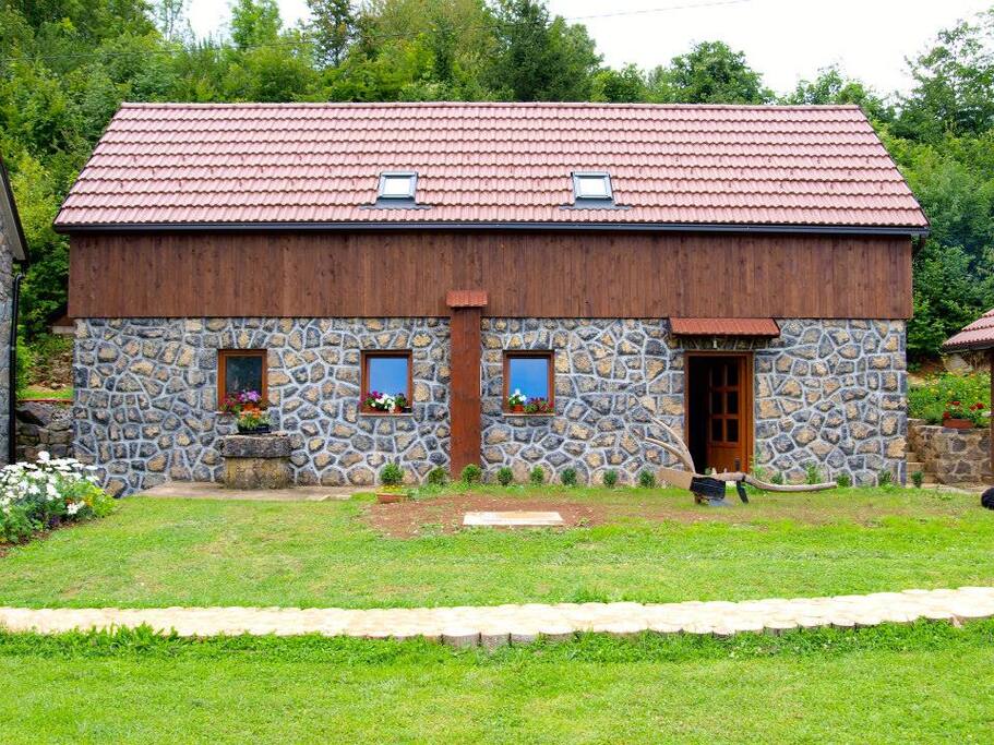 guest house: first floor - two 4 bed dorms + 2 bathrooms, main floor - shared kitchen space + 2 bathrooms.