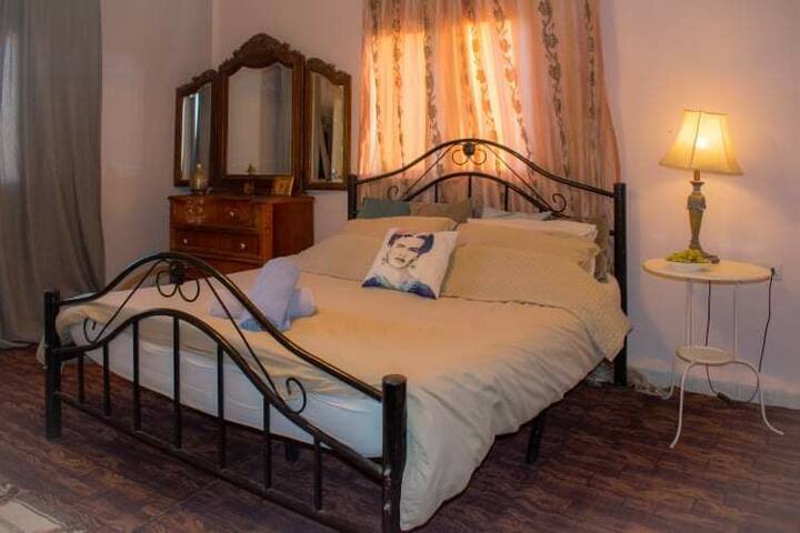 The double bed in bedroom 1