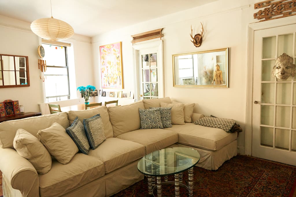 Big comfy couch, flat screen tv with Apple TV, dining nook, AC