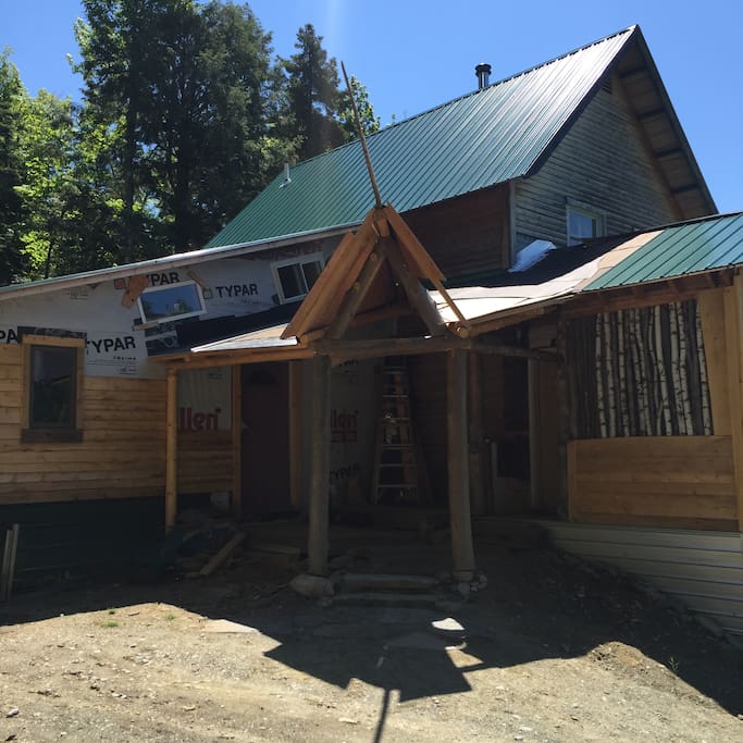Front entry way...the porch roof being expanded and finishing touches are being put on the addition apartment. Your door is to the right. The door to the left is our apartment. Please note we dont do any construction while guests are home.