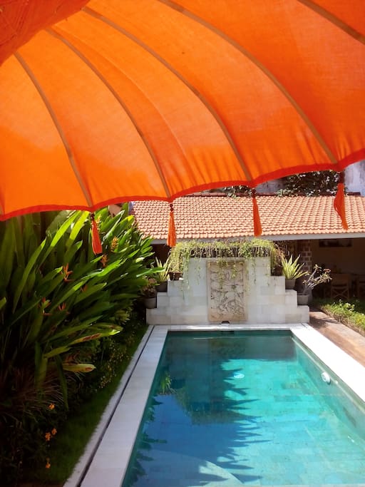 Enjoy The Swimming Pool and the Shadow from a Typical Ceremony Sunbrella...