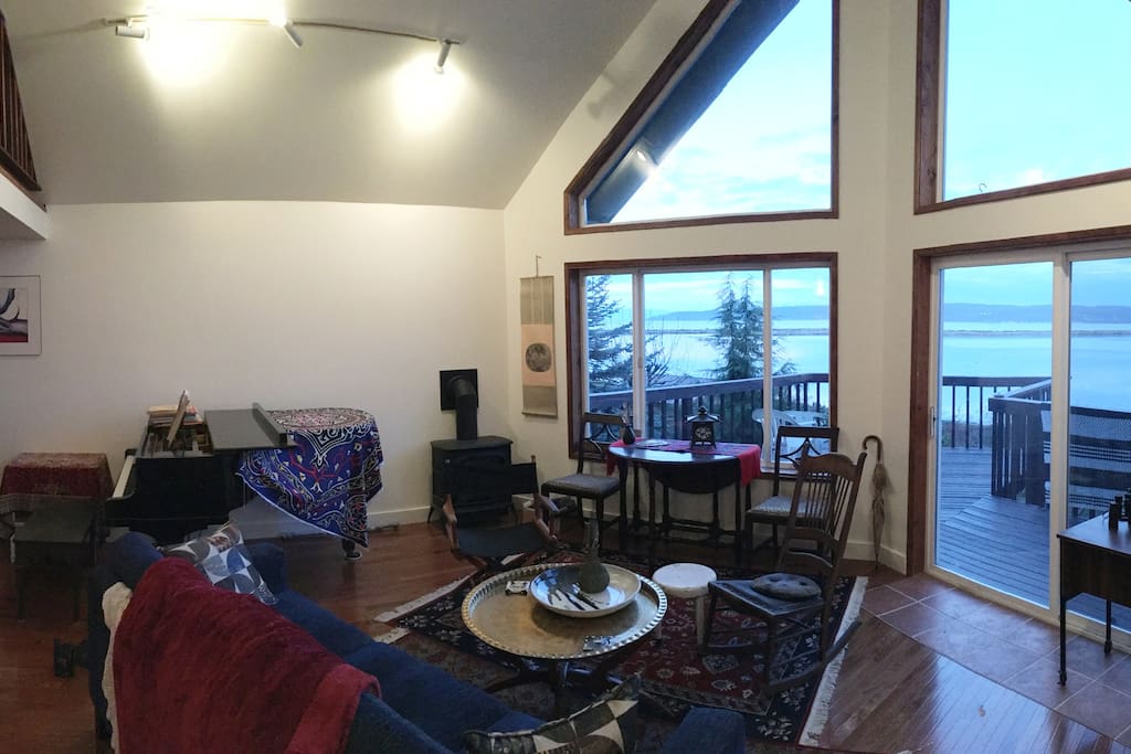 Living room with Yamaha grand piano and gorgeous vista