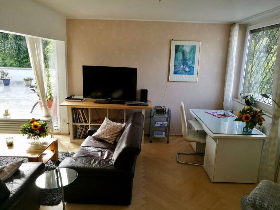 Living room with desk and media equipment