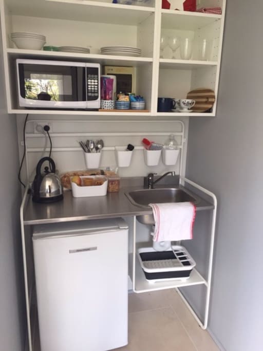 Kitchenette with fridge, microwave, toaster, kettle, tea and coffee facilities.