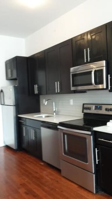 Full kitchen access with dishwasher as well as washer and dryer