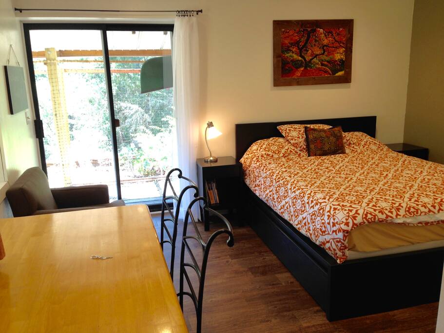 Here's where you'll stay. A sliding glass door looks out into our veggie garden.
