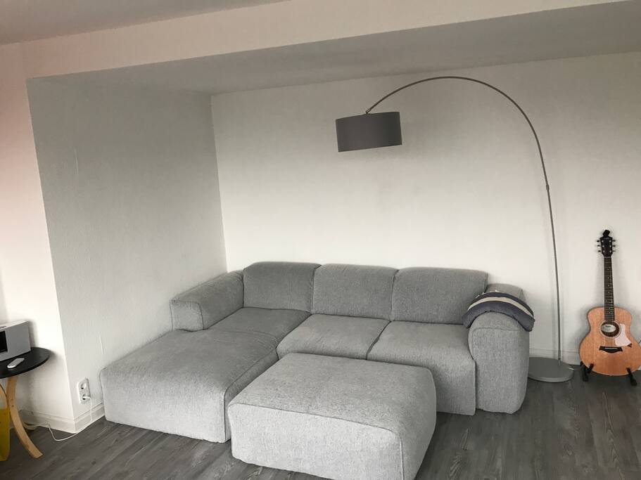 Lovely couch. Listen to music from BOSE speakers or make your own with a Tailor Guitar