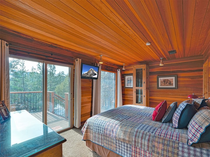 Bedroom #3: Downstairs. King size bed. Small closet + large chest  of drawers, sliding glass door to the front deck, beautiful views of mountains out of the windows,  TV equipped with Roku for streaming Netflix, Hulu, etc. Attached shared bathroom.