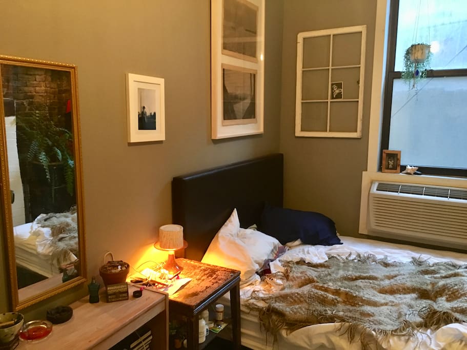 Bed and side table, window opens!