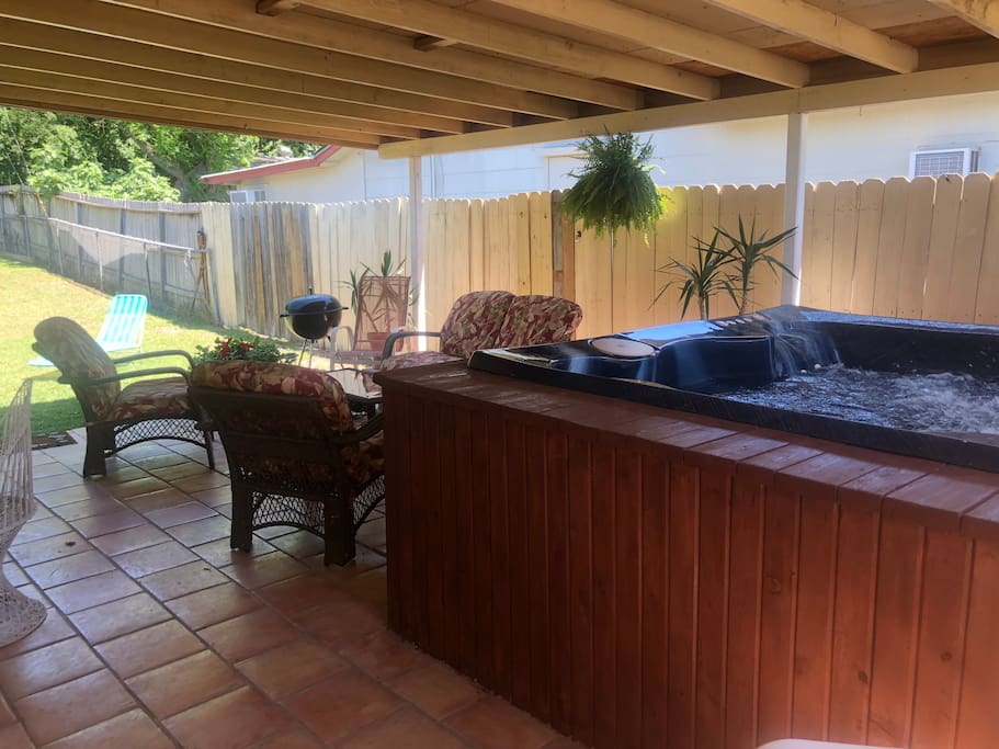 Side relaxing on porch and hot tub