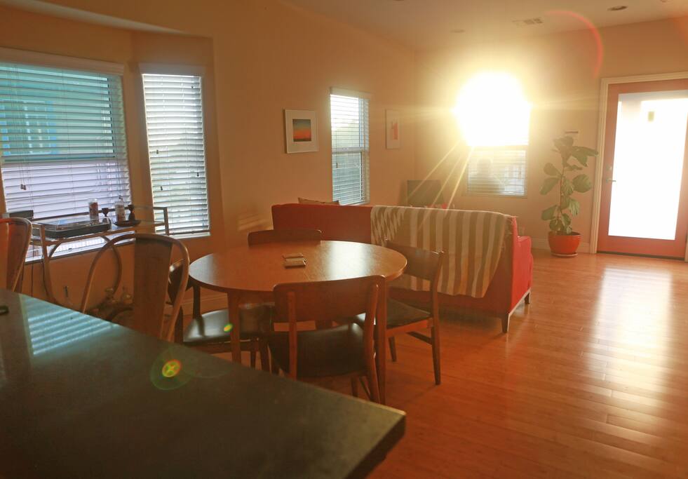 Mid-century dining table and stools, and a record player with a few dozen records to peruse.