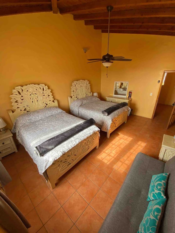 Bedroom #4: upstairs bedroom with two queen-size beds and futon sofa that converts to a bed.