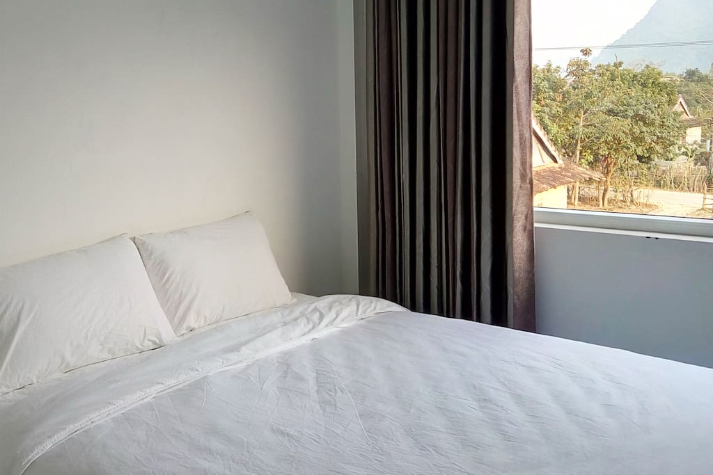 Double bed with magnificent village and mountain views