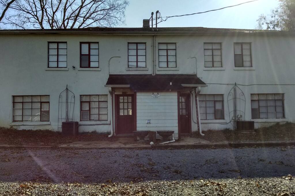 Apartment is on right, coin laundry in center