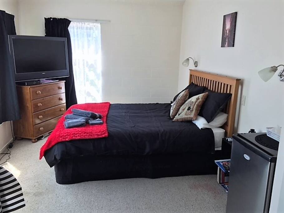 Room with Sky Tv and Fridge