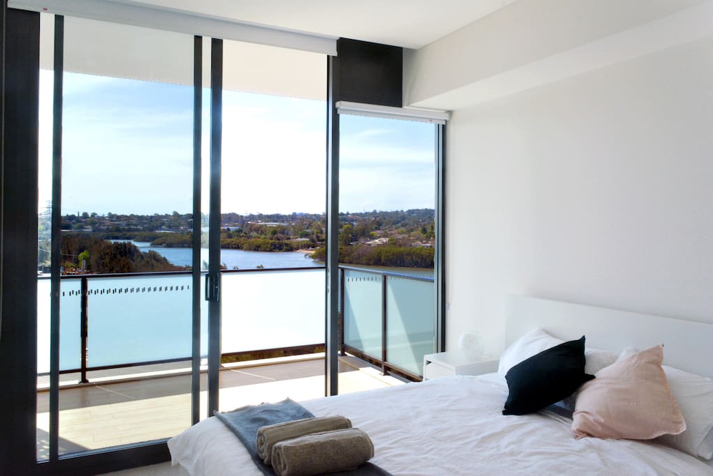 Spacious Queen bed in the bedroom with river view.