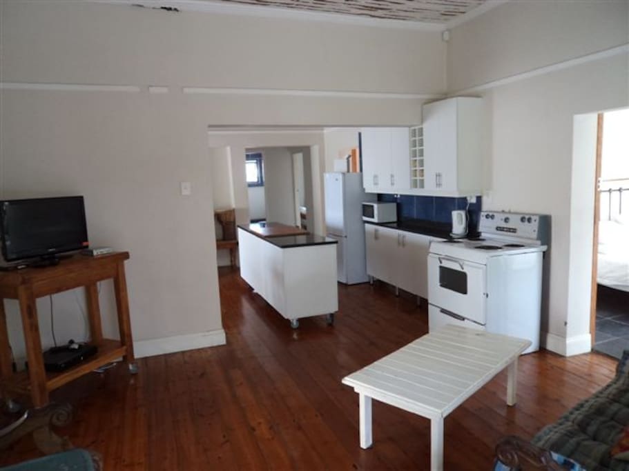 Open plan kitchen, dining and lounge area. This area is also open plan to the braai area