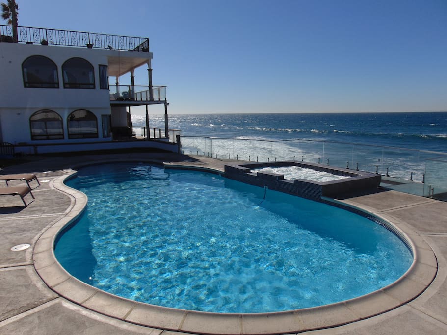 view from pool and jacuzzi to home