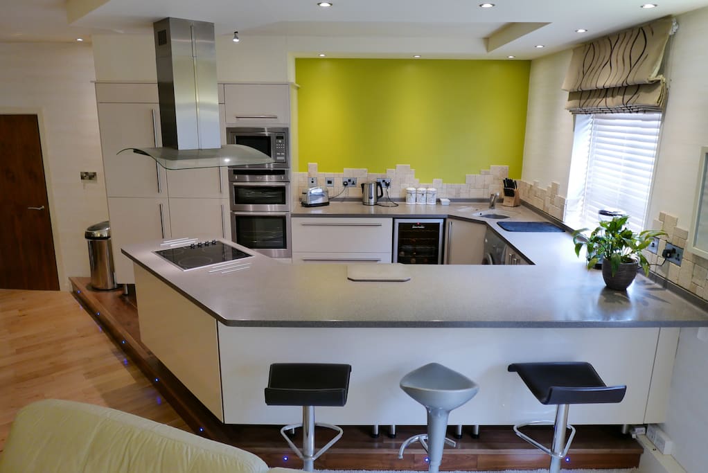 Fully fitted kitchen with breakfast bar.
