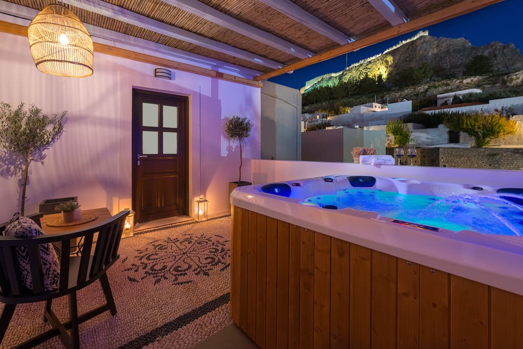First floor Open Air 5 seat Jacuzzi. Under the Acropolis of Lindos with a view to the Ancient Amphitheater.