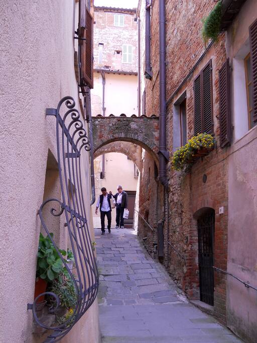 Looking back to main street - Apartment entrance through Iron gate