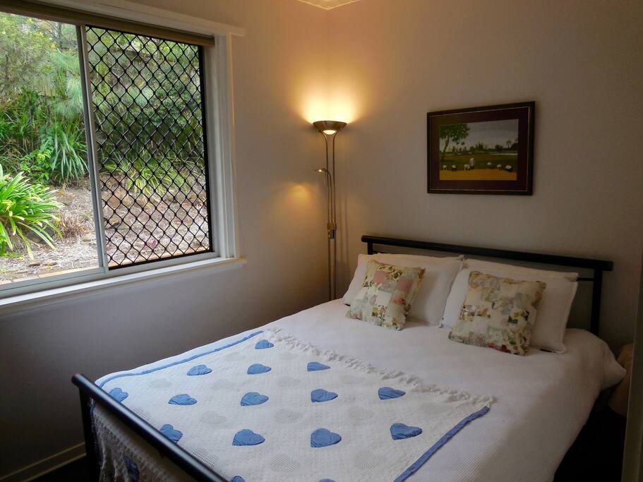 Airy queen bed room.