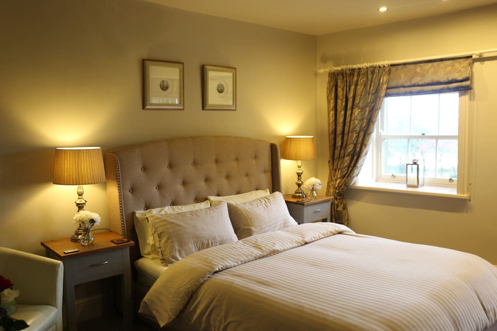 Newly furnished with a chesterfield bed, contemporary furnishings and two sash windows overlooking the garden and lake