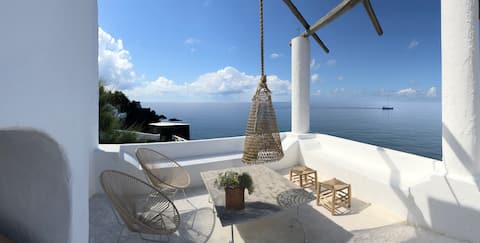 A terrace on the sea facing volcano
