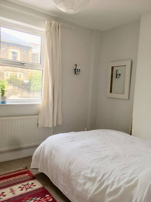 Your double bedroom w. hangers and chest of drawers.