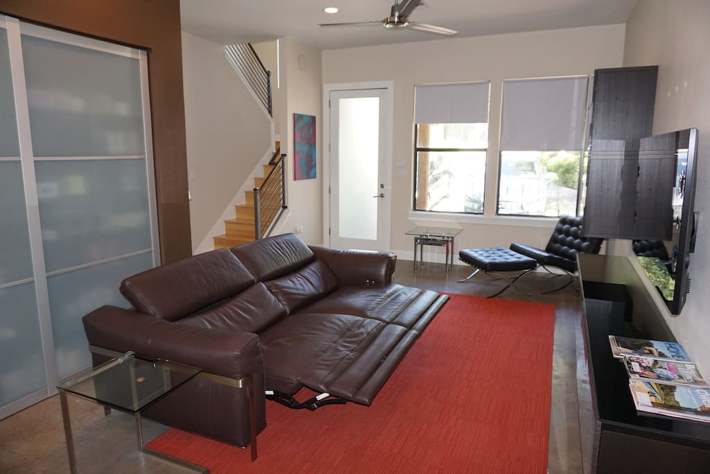 Living room with a Natuzzi sofa the opens for comfortable lounging